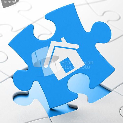 Image of Finance concept: Home on puzzle background