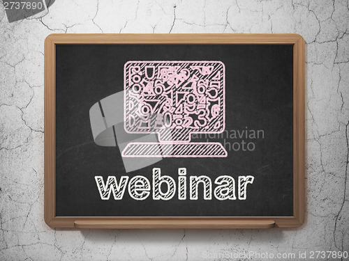Image of Education concept: Computer Pc and Webinar on chalkboard