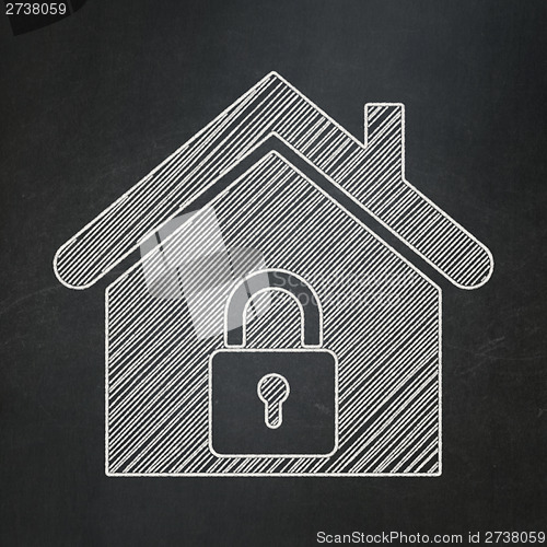 Image of Protection concept: Home on chalkboard background