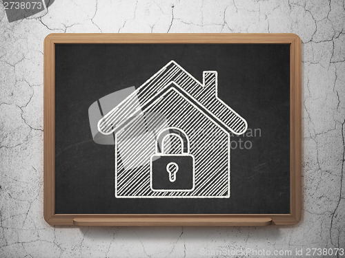 Image of Security concept: Home on chalkboard background