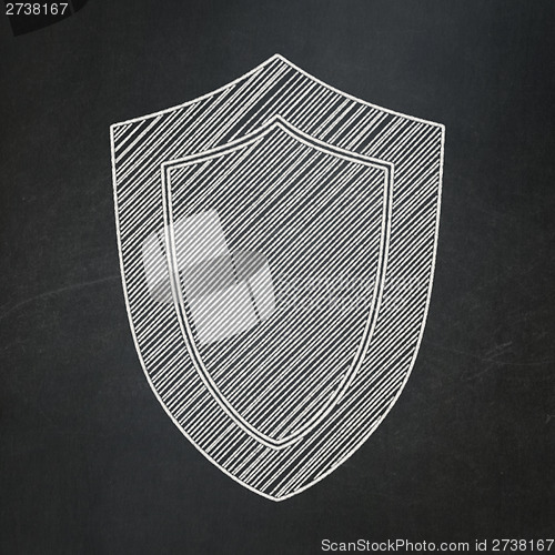 Image of Privacy concept: Shield on chalkboard background