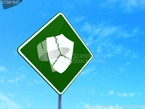 Image of Protection concept: Broken Shield on road sign background