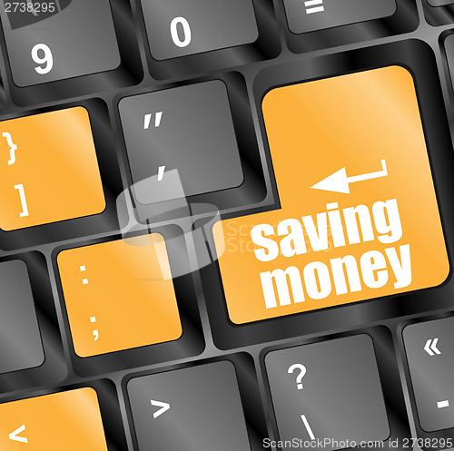 Image of save money for investment concept with a blue button on computer keyboard