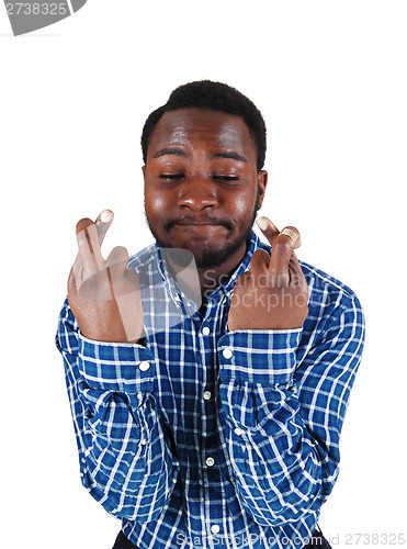 Image of Black man crossing finger.