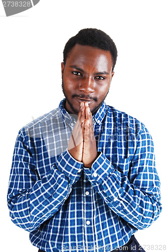 Image of Black man praying.