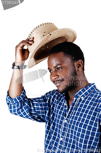 Image of Black man lifting his hat.