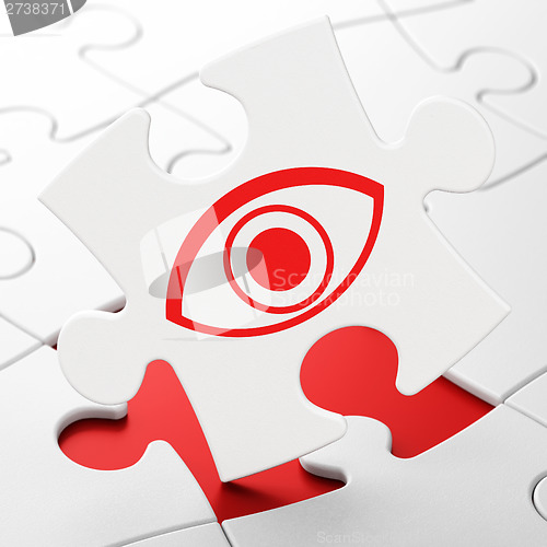 Image of Safety concept: Eye on puzzle background