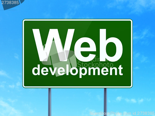 Image of Web design concept: Web Development on road sign background