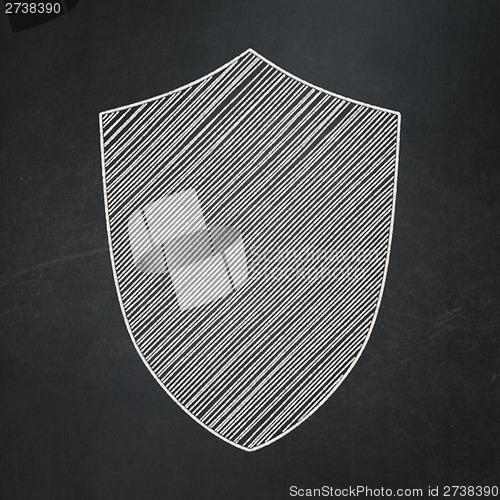 Image of Safety concept: Shield on chalkboard background