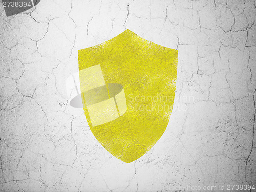 Image of Safety concept: Shield on wall background