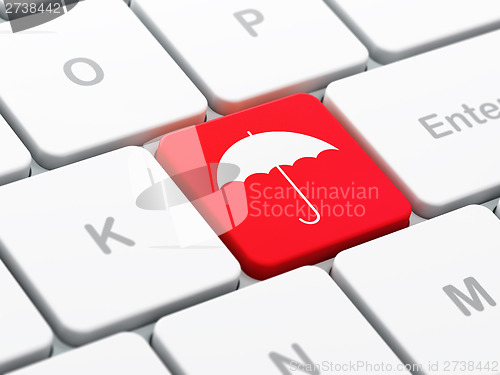 Image of Privacy concept: Umbrella on computer keyboard background