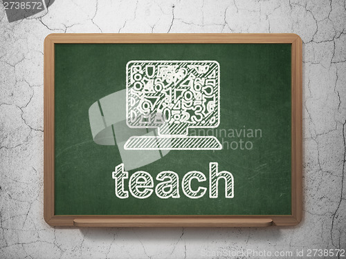Image of Education concept: Computer Pc and Teach on chalkboard