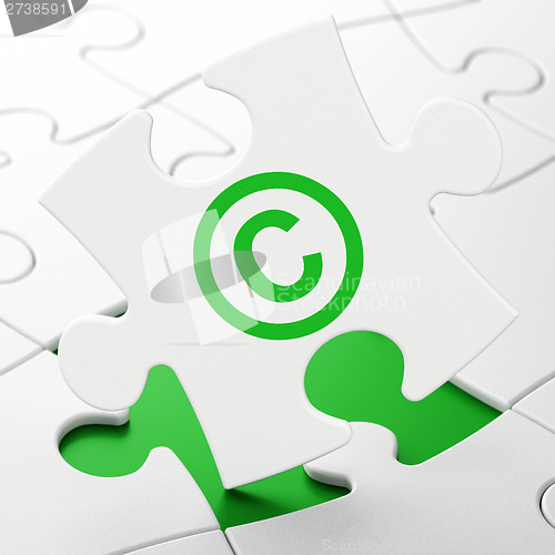 Image of Law concept: Copyright on puzzle background