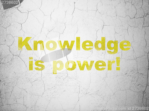 Image of Education concept: Knowledge Is power! on wall background