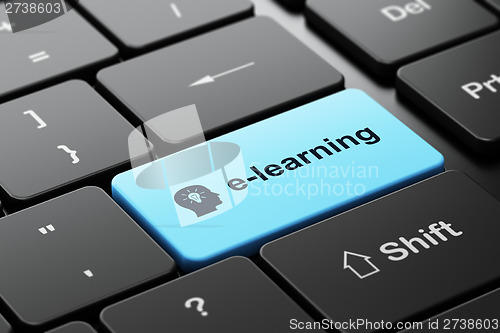 Image of Education concept: Head With Light Bulb E-learning on keyboard