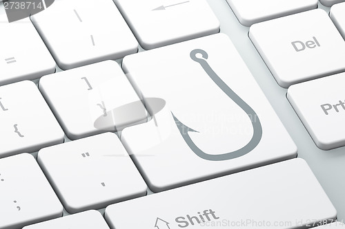 Image of Safety concept: Fishing Hook on computer keyboard background