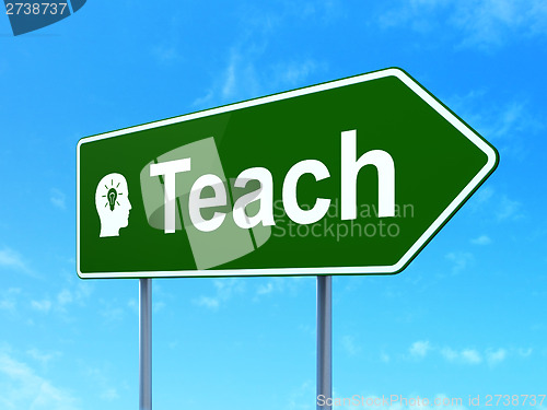 Image of Education concept: Teach and Head With Light Bulb on road sign