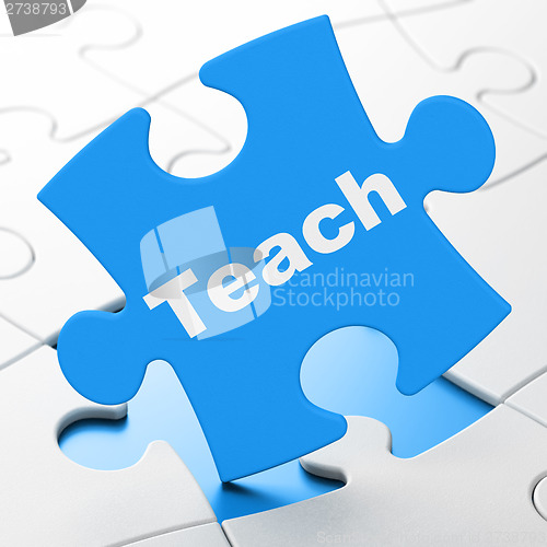 Image of Education concept: Teach on puzzle background
