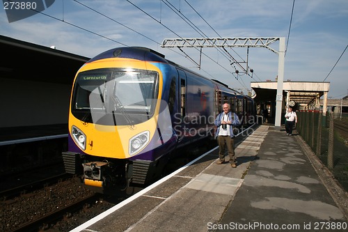 Image of modern train and train spotter
