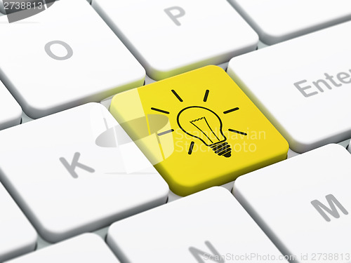 Image of Business concept: Light Bulb on computer keyboard background