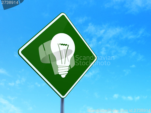 Image of Finance concept: Light Bulb on road sign background