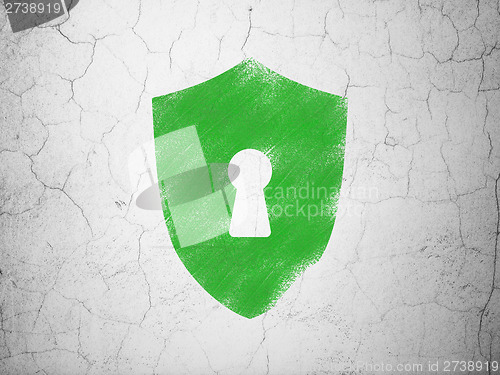 Image of Privacy concept: Shield With Keyhole on wall background