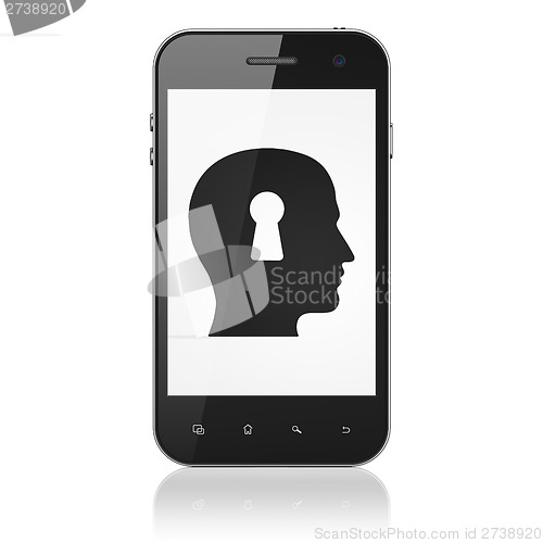 Image of Information concept: Head With Keyhole on smartphone