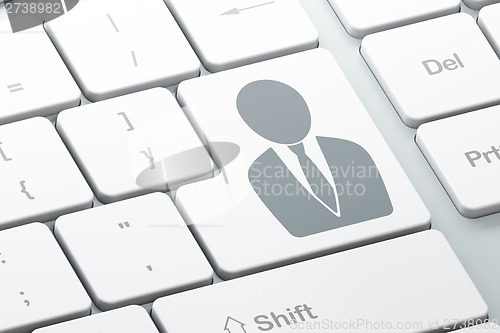 Image of Marketing concept: Business Man on computer keyboard background