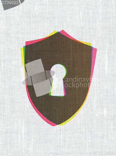 Image of Safety concept: Shield With Keyhole on fabric texture background