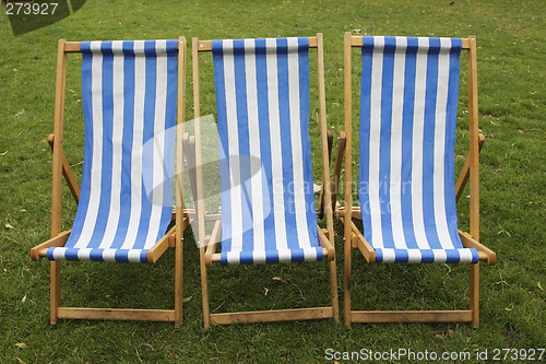 Image of blue and white stripped empty deckchairs