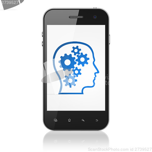 Image of Information concept: Head With Gears on smartphone