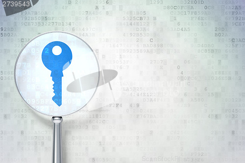 Image of Security concept:  Key with optical glass on digital background
