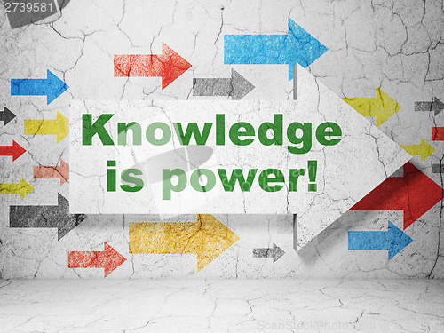 Image of Education concept: arrow Knowledge Is power! on grunge wall