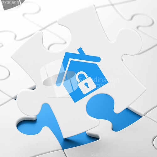 Image of Finance concept: Home on puzzle background