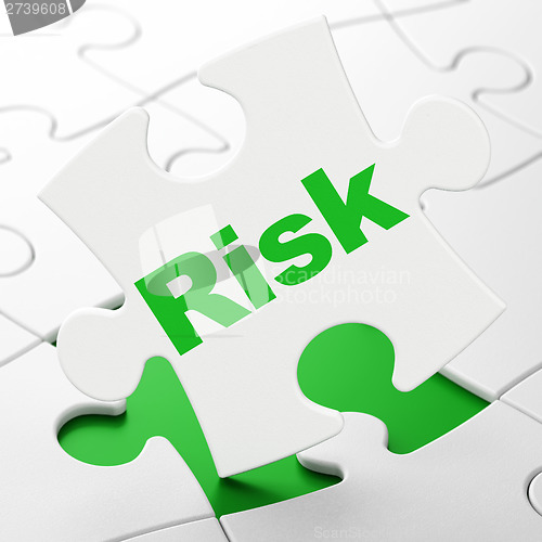 Image of Finance concept: Risk on puzzle background