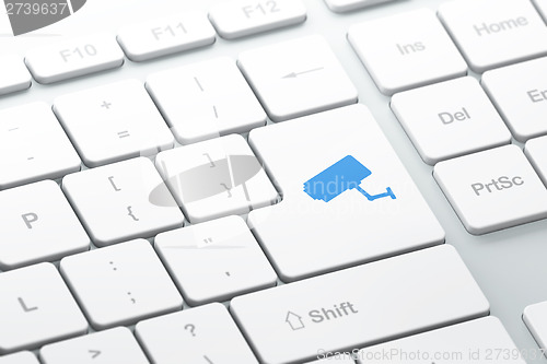 Image of Protection concept: Cctv Camera on computer keyboard background