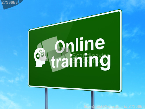 Image of Education concept: Online Training and Head Gears on road sign