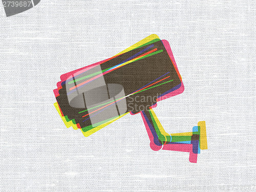 Image of Safety concept: Cctv Camera on fabric texture background