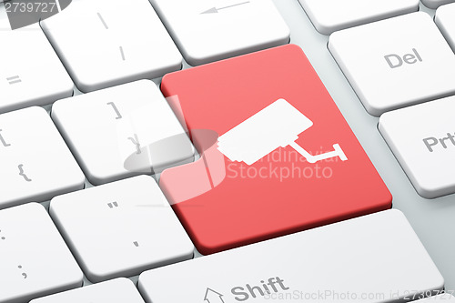 Image of Safety concept: Cctv Camera on computer keyboard background