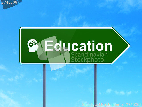 Image of Education and Head With Gears on road sign