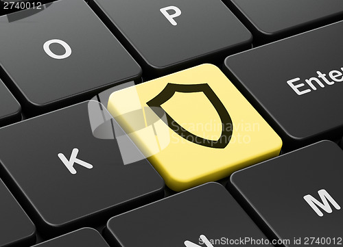 Image of Protection concept: Contoured Shield on computer keyboard