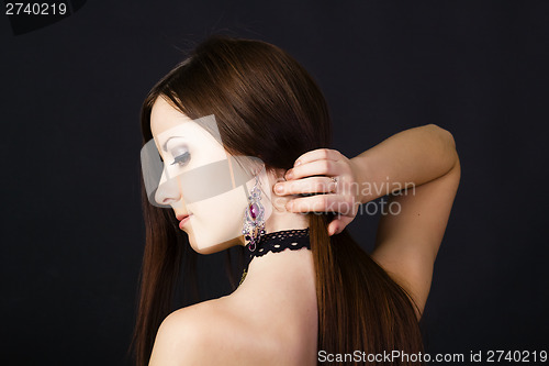 Image of Beautiful young girl in profile with long straight hair