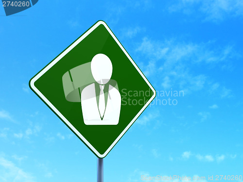 Image of Finance concept: Business Man on road sign background