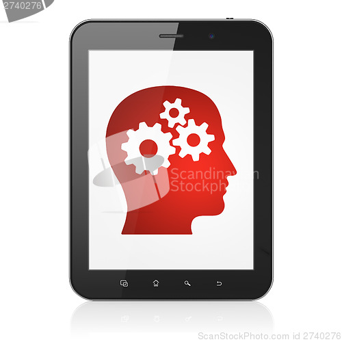 Image of Education concept: Head With Gears on tablet pc computer