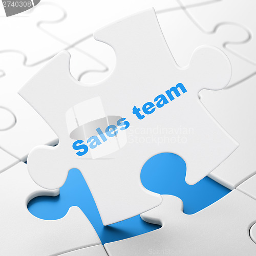Image of Marketing concept: Sales Team on puzzle background