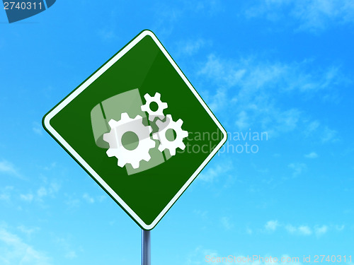 Image of Business concept: Gears on road sign background