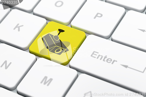 Image of Privacy concept: Cctv Camera on computer keyboard background