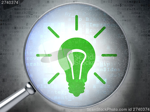 Image of Business concept:  Light Bulb with optical glass on digital