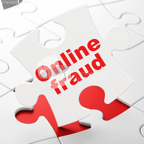 Image of Protection concept: Online Fraud on puzzle background