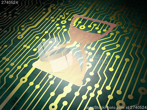 Image of Time concept: circuit board with Hourglass